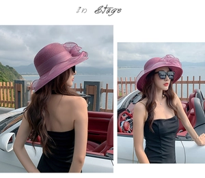 Detailed side view of the purple organza sun hat featuring a large 3D floral decoration