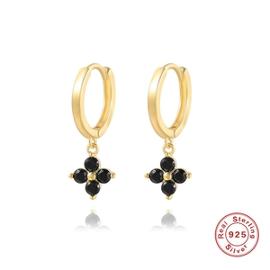 Detail of S925 sterling silver hoop earrings with black quatrefoil flower charms