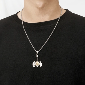 Detailed view of Viking double axe pendant with golden Valknut symbol on a silver chain