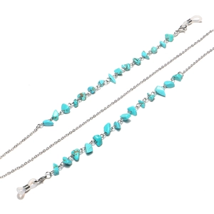 Detailed macro of turquoise stone beads and silver chain link for eyewear strap