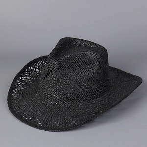 Detail of black hollowed-out straw cowboy hat showing breathable woven texture and curved brim