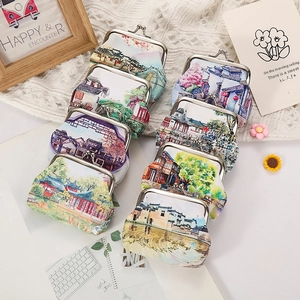 Flat lay of vintage kiss-lock coin purses with traditional Chinese floral and landscape patterns