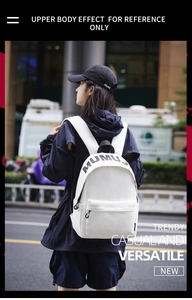 On-body view of a stylish white college-style backpack with trendy black lettering print
