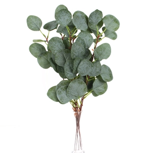 Detailed view of artificial eucalyptus leaves with white frost texture and small green berries