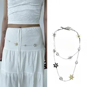 Silver waist chain with multicolor flowers and beads for women on white lace outfit