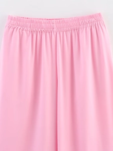 Detailed view of pink drawstring elastic waistband showing premium soft fabric texture