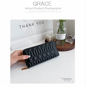 Close-up of black quilted PU leather long wallet with elegant gold zipper and GRACE branding
