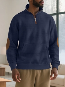 Detail of navy men's quarter-zip hoodie with waffle texture and brown elbow patches