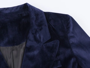 Detail of navy velvet blazer showing the lapel collar and premium stitching quality