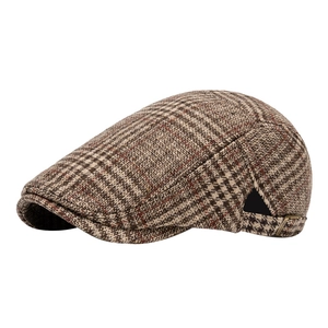 Classic plaid newsboy cap in brown tweed with a vintage metal buckle for autumn winter