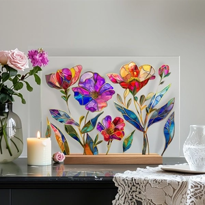 Floral stained glass style acrylic plaque with wooden base on a cozy candlelit table