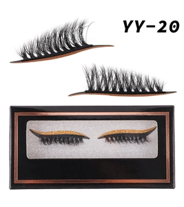 Macro detail of YY-20 false eyelashes featuring black fibers and gold glitter eyeliner band
