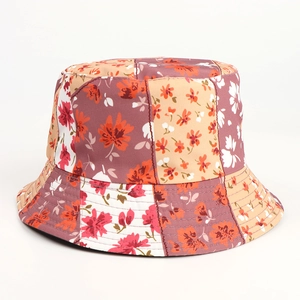 Detail view of colorful floral patchwork bucket hat with reinforced brim stitching
