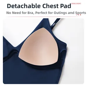 Detailed close-up showing the removable pads of a navy blue fitness yoga sports bra