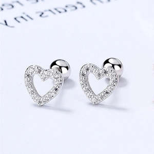 Detail of 925 sterling silver heart stud earrings with cubic zirconia and screw backs