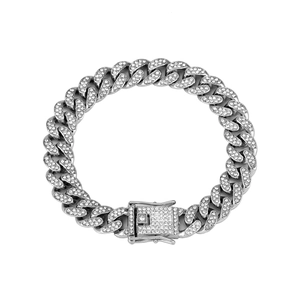 Macro detail of silver iced out Cuban link chain with sparkling rhinestones and buckle