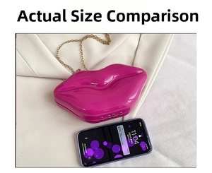 Detailed comparison of fuchsia lip-shaped clutch bag next to a smartphone size reference
