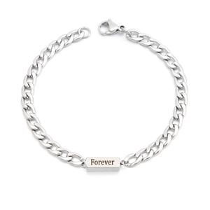 Detailed view of silver chain bracelet with rectangular Forever engraved metal plate