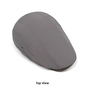 Top view of dark grey flat cap showing textured fabric and ventilation eyelets