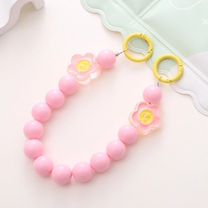 Pink acrylic bead phone strap with yellow smiley face flower charms and gold clips