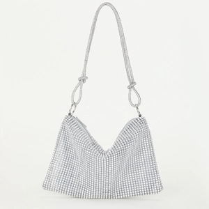 Detailed view of silver rhinestone evening bag with knotted strap and zipper closure