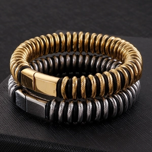 Men's industrial style bracelets set with gold and silver metallic spiral and rubber cords