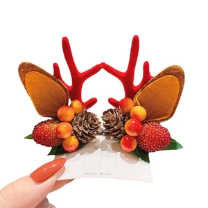 Christmas reindeer antler hair clip with red felt, pine cones, and berries for girls