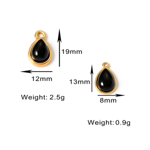 Macro view of teardrop natural stone pendants in two sizes with gold metal frames