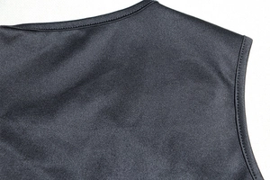 Detail of the high-quality neckline stitching on a black knitted two-piece fashion set
