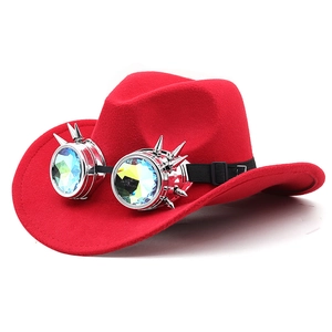 Red western cowboy hat with steampunk spiked kaleidoscope goggles on a plain background
