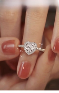 Detailed view of S925 sterling silver heart-shaped moissanite ring with halo setting
