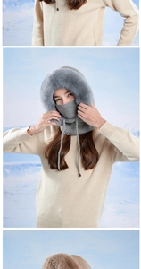 Close-up of grey knit winter hood with thick faux fur lining and adjustable drawstrings