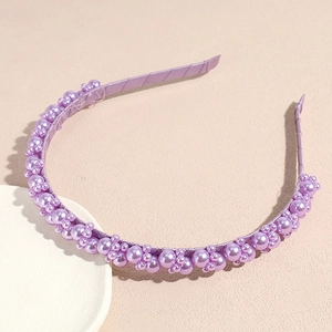 Elegant purple beaded headband with assorted faux pearls and soft satin fabric