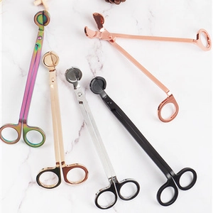 Flat lay of metal candle wick trimmers in black, silver, gold, rose gold and rainbow colors