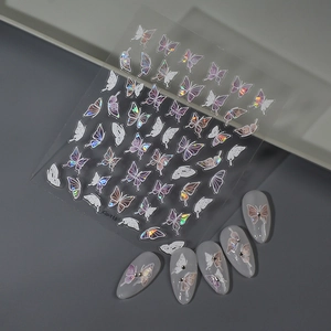 Macro shot of 3D holographic butterfly nail stickers and shell-style nail art decals