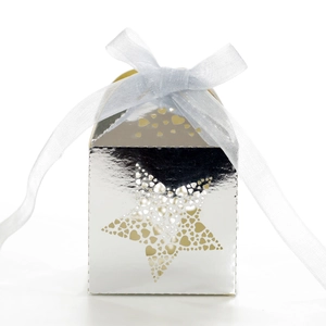 Detail of silver mirror gift box featuring heart-shaped star cutouts and a blue ribbon
