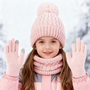 Pink winter knit set for kids featuring a pom pom hat, neck warmer, and touchscreen gloves