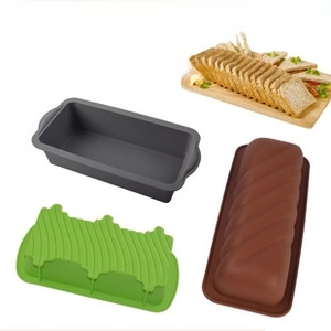 Three assorted silicone toast molds in gray, green, and brown for home kitchen baking