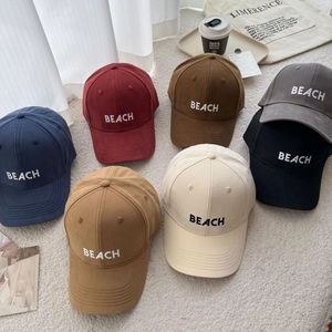 Detailed collection of embroidered cotton baseball caps in seven versatile colors