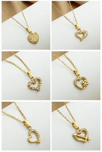 Detailed grid view of six gold heart pendant necklaces featuring zircon inlays and patterns
