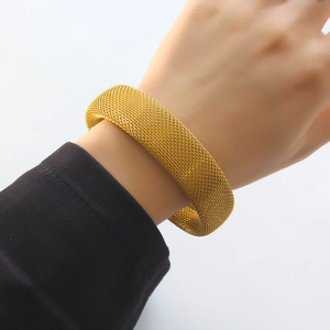 Elegant gold mesh stainless steel C-shaped cuff bracelet for women shown on a wrist