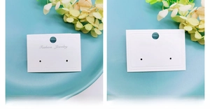 White cardboard jewelry display cards with Fashion Jewelry print and hanging holes