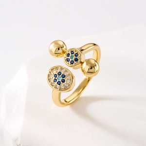 Irregular geometric open ring in gold finish with blue and white zircon evil eye design