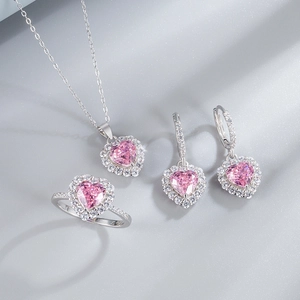 Elegant 925 sterling silver jewelry set featuring pink heart-shaped crystal accents