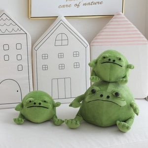 Three sizes of cute green frog plush toys set on a clean white minimalist background