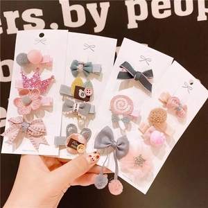 Cute children's fabric hair clips set with crowns and flowers on display board