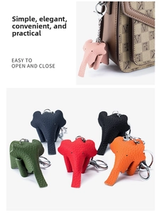 Macro detail of elephant leather charms with pebbled texture and metal lobster clasps
