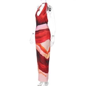 Detail showing the halter neck design and abstract wave print on the long dress