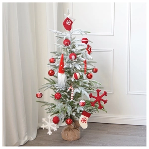 Mini flocked Christmas tree with red and white wool felt ornaments and burlap base
