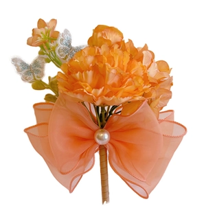 Orange and peach faux carnation corsage with organza bow and sparkling butterfly decoration